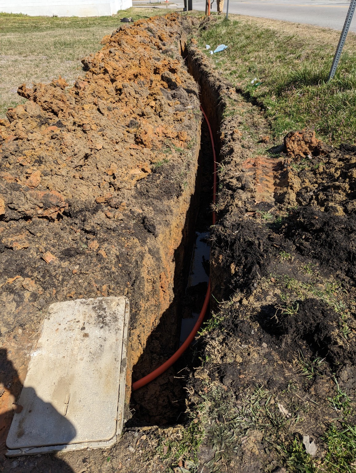 Long trench with conduit installed for underground service